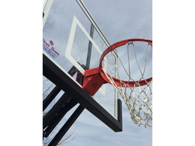 First Team Champ In Ground Adjustable Basketball Goal Close-Up View
