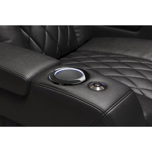 Valencia Tuscany Console Close-up of a chair's quilted black leather armrest with cup holder and storage compartment.