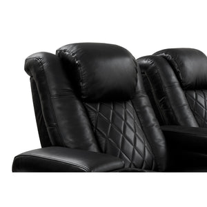 Valencia Tuscany Console Black leather recliner with diamond quilted pattern.
